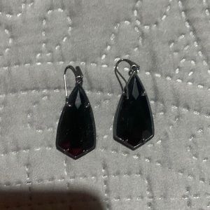 All black multifaceted Kendra Scott earring.